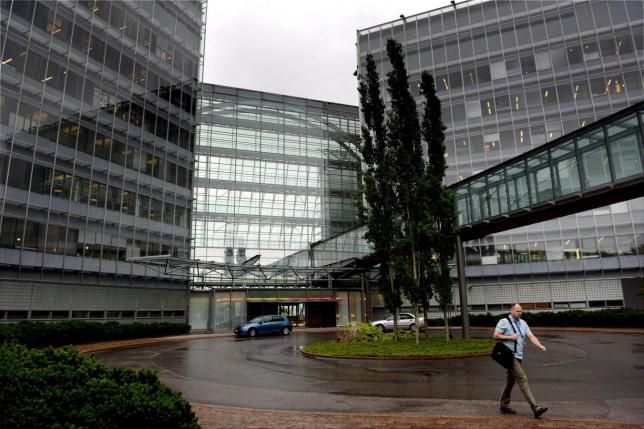 A Microsoft employee walks at its Finnish headquarters in Espoo, Finland.