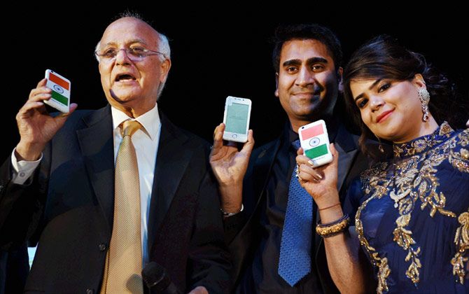 Ashok Chadha, President, Ringing Bells with Director Mohit Goel and CEO, Dhaarna Goel during the launch of Smartphone-Ringing Bells Freedom 251, in New Delhi