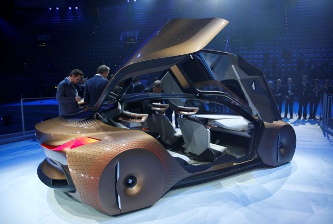 People look at the BMW 'Vision Next 100' concept car