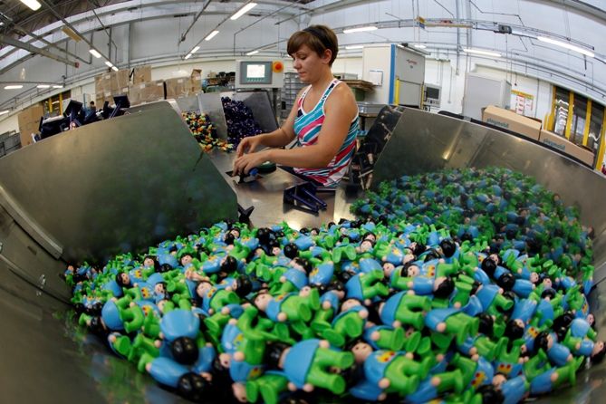 Workers make stuffed dolls which are to exported to Europe and north America, at a factory in Lianyungang, Jiangsu province, China.