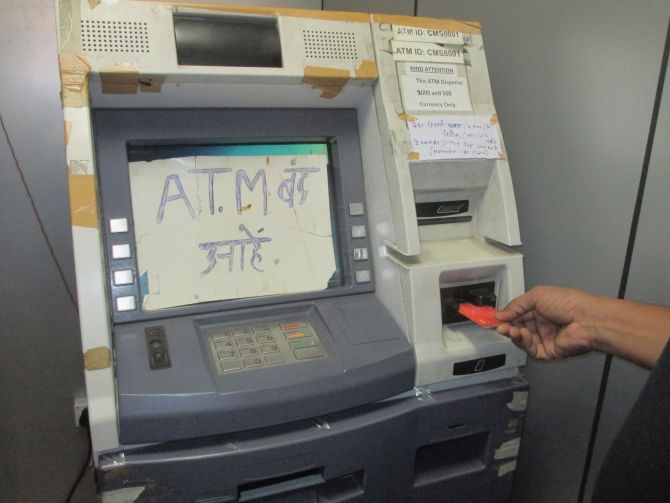 An ATM in Mumbai runs out of cash on Friday, November 11, soon after reopening after a two-day break to rejig its systems and issue new currency denominations