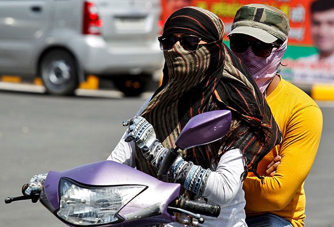 A couple ride a scooter on a hot day in Allahabad, India ApA couple ride a scooter on a hot day in Allahabad, India April 4, 2017. Photo: Jitendra Prakash/Reuterstendra Prakash/REUTERS