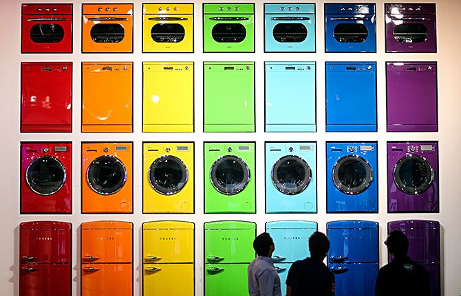 Visitors look at a display of stoves, dishwashers, washing machines and integrated fridge freezers (from top to bottom) produced by Vestel during the IFA Electronics show in Berlin September 4, 2014. Photo: Hannibal Hanschke/Reuters 