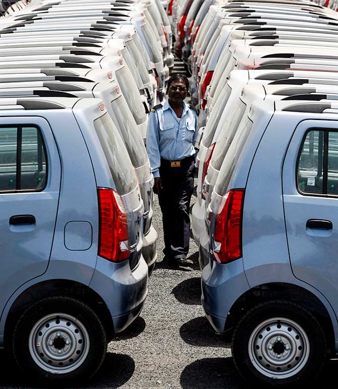 A security personnel officer walks at a Maruti Suzuki stockyard on the outskirts of the western Indian city of Ahmedabad April 26, 2010. Photo: Amit Dave/Reuters