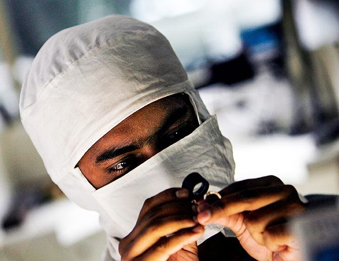 An employee at a diamond cutting and polishing factory in Surat, Gujarat. Photograph: Arko Datta/Reuters