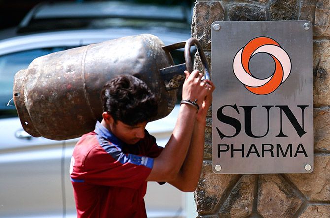 A man carrying a gas cylinder walks out of the research and development centre of Sun Pharmaceutical Industries Ltd in Mumbai May 29, 2014. Sun Pharmaceutical Industries Ltd, India's third-largest drugmaker by revenue, on Thursday reported a 57 percent jump in fourth-quarter net profit, slightly above expectations, helped by higher sales in the United States, its largest market. Photo: Danish Siddiqui/Reuters