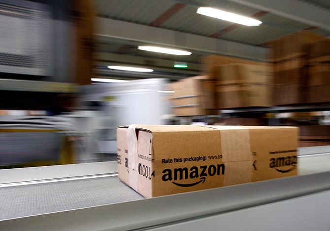 A parcel moves on the conveyor belt at Amazon's logistics centre in Graben near Augsburg, Germany. Photograph: Michaela Rehle/Reuters. 