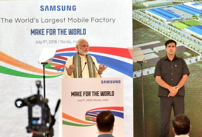 Image result for PM Modi launched World's biggest Mobile Factory at Noida