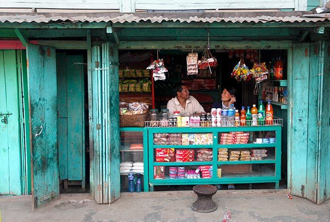 A couple runs a small store in Litan village, outside Imphal, Manipur. Photograph: Rupak De Chowdhuri/Reuters.