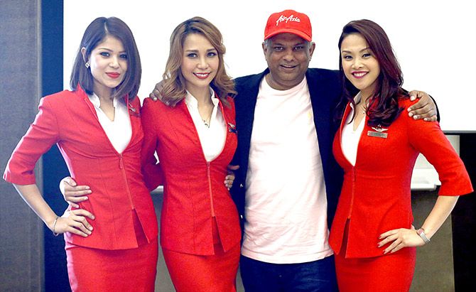 AirAsia's chief executive officer, Tony Fernandes poses for photos after a media conference near Changi Airport in Singapore. Photograph: Edgar Su/Reuters.