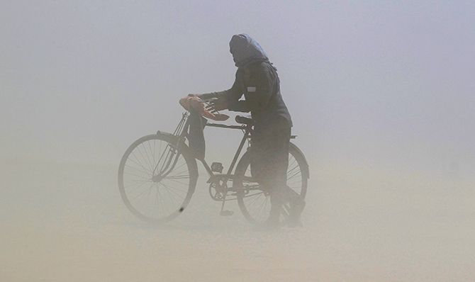 A duststorm on the banks of the Ganga, Allahabad, Uttar Pradesh. Photograph: Jitendra Prakash/Reuters.
