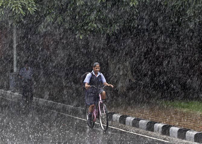 A schoolgirl rides home in Chandigarh. Photograph: Ajay Verma/Reuters. 