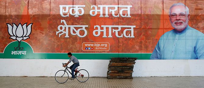 Bharatiya Janata Party rides past the party's headquarters in New Delhi. Photograph: Anindito Mukherjee/Reuters.