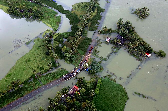 An aerial view shows partially submerged road at a flooded area in Kerala on August 19. Photograph: Sivaram V/Reuters.