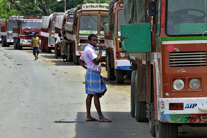 Truckers waiting to get his loads cleared to cross a checkpoint at a checkpost at Walayar, Palakkad district, Kerala. Photograph: V Sivaram/Reuters
