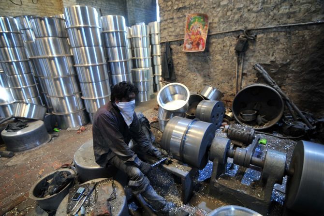 Laborers work in a utensil manufacturing factory at micro, small, and medium enterprises (msme) unit. Photograph: ANI Photo.