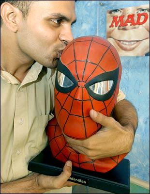 Studio Chief of Gotham Studios India, Jeevan J. Kang poses with a bust of comic-book hero Spider-Man at the Gotham Entertainment Group office in Bangalore