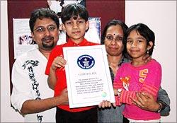 Master Kishan holds his Guinness certificate