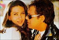 With Karisma Kapoor in this still from Hero No 1