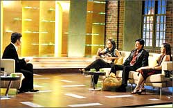 Karan Johar with Kajol, Shah Rukh Khan and Rani Mukerji on the sets of Koffee with Karan