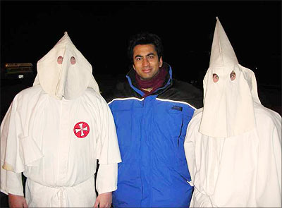 Kal Penn, flanked by actors playing members of the Ku Klux Klan