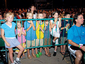 Children listen to Kailash Kher at a concert in Brooklyn