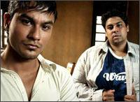 Kumal Khemu and Cyrus Broacha in a  scene from 99