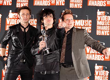 Members of Green Day pose with their award