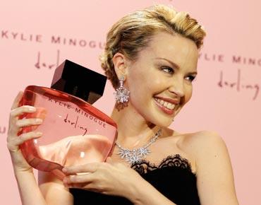 Kylie Minogue poses with her perfume Darling in London.