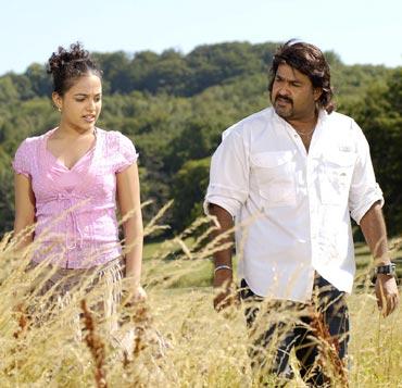 Nithya Menon and Mohanlal in a scene from Akashagopuram