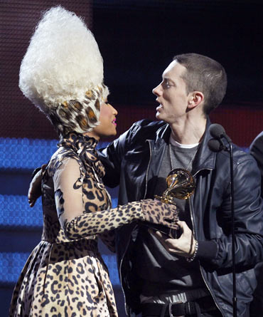 Presenter Nicki Minaj gives Eminem his award for Best Rap Solo Performance for Not Afraid
