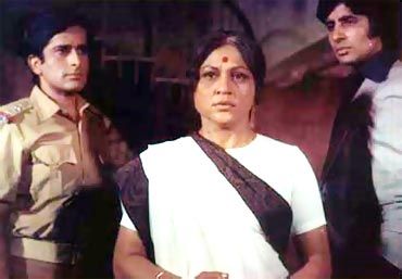 Shashi Kapoor, Nirupa Roy and Amitabh Bachchan in Yash Chopra's Deewar.