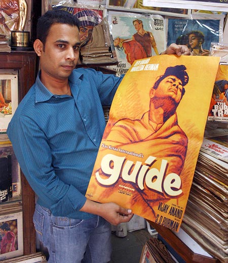 Haji Abu with the poster for Guide