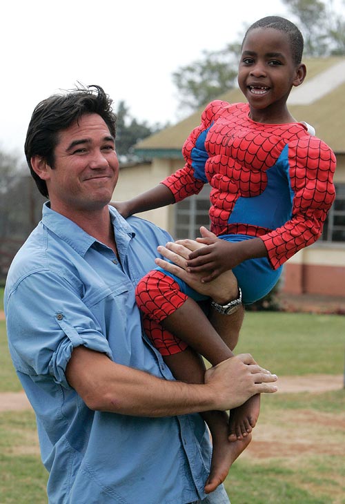 Actor Dean Cain holds a child
