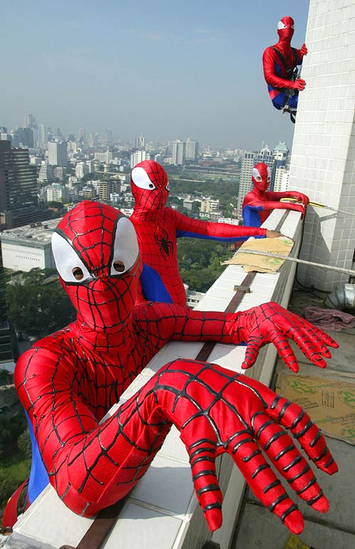 Men dressed in Spider-Man outfits