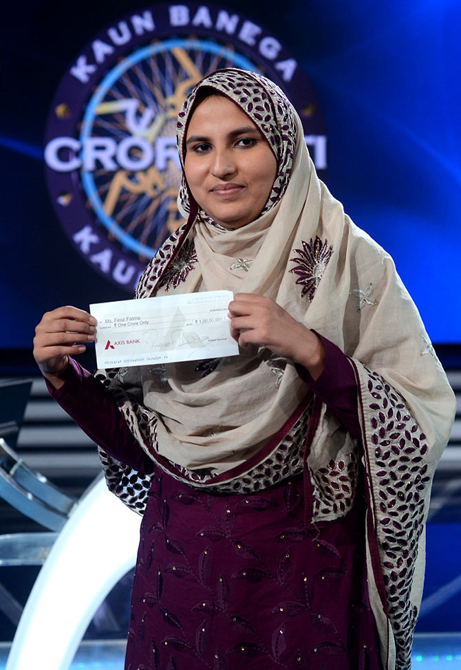 Firoz Fatma with the winning cheque.