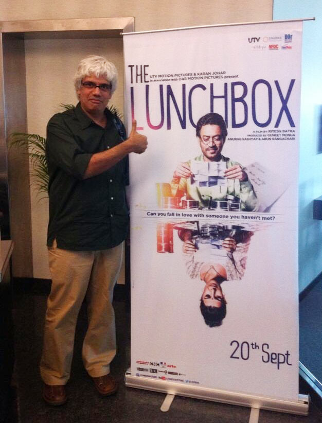 Director of The Good Road Gyan Correa with the poster of The Lunchbox