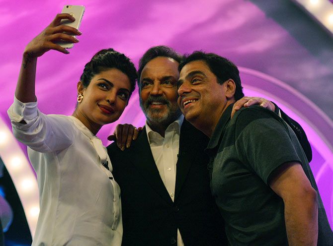 Prannoy Roy, centre, with Priyanka Chopra, left, and Ronnie Screwvala