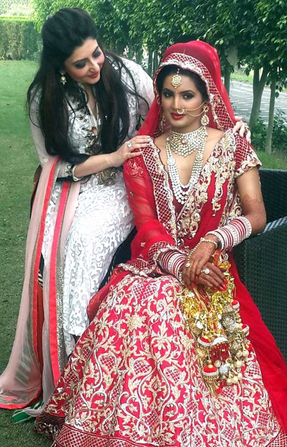 Harbhajan Singh's bride Geeta Basra poses in all her wedding splendour on Thursday