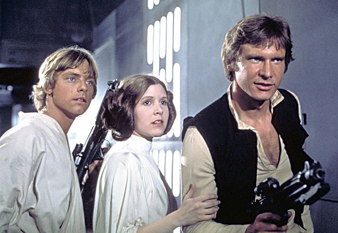 Luke Skywalker, Princess Leia and Han Solo played by Mark Hamill, Carrie Fisher and Harrison Ford in Star Wars, Episode IV: A New Hope (1977).