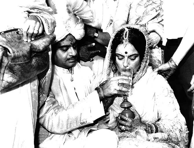 The newly weds: Poonam Sinha breaks her fast with a sip of water given by her husband, Shatrughan