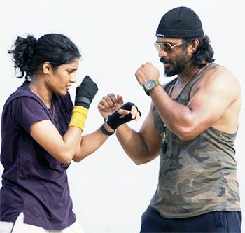 Ritika Singh and R Madhavan in Irudhi Suttru