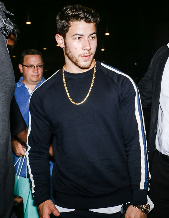 Nick Jonas arrives in India with his parents! - Rediff.com movies