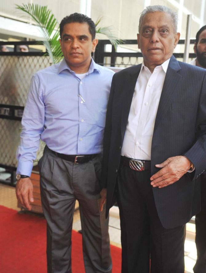 Producer Firoz Nadiadwala, left, with his father A G Nadiadwala at the Dadasaheb Phalke Academy Awards 2013 in Mumbai.