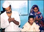 Abdul Manaf Jamadar and his family offer prayers