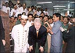 President Clinton poses with the Maurya's staff