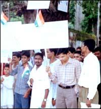 Asrat Ansari holding the national flag