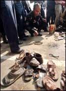 A Bangladeshi official inspects a bombing site