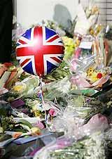 A balloon with a Union flag design in an area set aside for floral tributes beside King's Cross station in London, for victims of the last week's London bombings. AP Photo/Matt Dunham