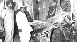 Air Chief Marshal Arjan Singh with Defence Minister Y B Chavan inspect a downed Pakistani Sabre aircraft at an air base near Delhi